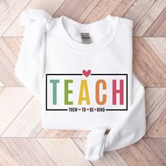 Teach Love Inspire Sweatshirt, Teacher Hoodie, Leopard Teacher Sweater, First Grade teacher, Elementary Teacher Long Sleeve, Back To School 🎀Welcome to the Modtrendy Clothing👕🎁 BLACK TEXT is used for Yellow, Heather Peach, White, Athletic Heather, Mint, Pink, Baby Blue Shirts. Other colored shirts have white text. F I T ∙ & ∙ S I Z I N G : ✨Women's sizes are narrower than the waist. ✨Sleeves are rolled up in some product pictures. They do not come rolled up on delivery. T I M E ∙ T O ∙ D E L Letter Print Hoodie Top, White Fall Sweatshirt For School, Letter Print Hoodie For School, White Pre-shrunk Sweatshirt For School, School Hoodie With Letter Print, White Long Sleeve Sweatshirt For School, Winter School Sweatshirt, Pre-shrunk, White Long-sleeve Sweatshirt For School, White Sweatshirt For Teacher Appreciation In Fall