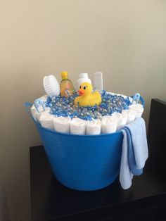 a bath tub filled with lots of soap and rubber ducky toys on top of it