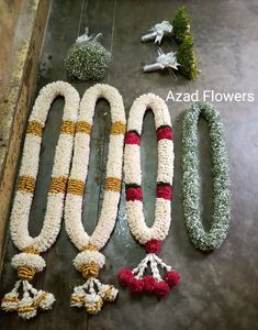 flowers and garlands laid out on the floor