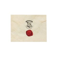 an envelope with a wax stamp on it and a seal in the middle that says hogwarts