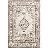 a rug with an intricate design on the front and back side, in grey tones