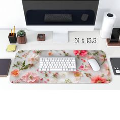 a computer desk with a keyboard and mouse on it, next to other office supplies