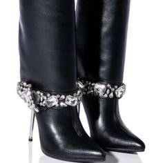 The Azalea Wang" Dripping Fold Over Rhinestone" Gem Stiletto Bootie In Black Is Made From A Chic Vegan Leather Upper And Features A Mid-Calf Height Shaft, A Covered Reflective Stiletto Heel, A Pointed Toe Silhouette, And A Pull-On Fit. Complete With A Clustered Rhinestone Gem-Detailed Band Around The Ankle. - Vegan Leather Upper - Pointed Toe - Stiletto Heel - 13.75” Shaft Height - 4.25” Heel Height Pointed Toe Rhinestone Cocktail Boots, Cocktail Boots With Rhinestones And Pointed Toe, Cocktail Rhinestone Boots With Pointed Toe, High Heel Rhinestone Boots For Cocktail, Cocktail High Heel Boots With Rhinestones, Elegant Bedazzled Evening Boots, Elegant Evening Bedazzled Boots, Leather Party Boots With Rhinestone Fringe, Party Leather Boots With Rhinestone Fringe