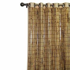 a bamboo curtain hanging on the side of a window