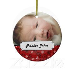 a christmas ornament with a baby's photo on it