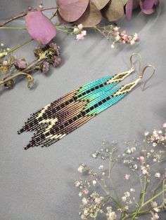 Delicate, natural color palette bohemian fringe earrings are made fully by hands from smallest Japanese Delica seed beads and gold plated ear wires, that's why they are lightweight and comfortable to everyday wear. The turquoise and brown color combination is both natural and interesting, and can be suitable for different looks. You will receive earrings in the individual box with logo. Bohemian Turquoise Tassel Earrings With Beaded Fringe, Bohemian Long Drop Tassel Earrings With Colorful Beads, Handmade Long Drop Bohemian Tassel Earrings, Bohemian Turquoise Beaded Fringe Earrings, Turquoise Bohemian Beaded Fringe Earrings, Bohemian Long Drop Fringe Earrings, Artisan Turquoise Beaded Fringe Earrings, Handmade Bohemian Long Drop Tassel Earrings, Handwoven Turquoise Bohemian Earrings