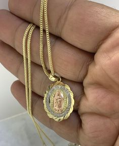 ● 10k Mother Mary Religious Solid Gold Medal Franco Necklace Chain Pendant Charm Virgin Mary Oval Shape Jewelry ●Metal Pendant : 10K Yellow Gold ●Purity : 10k with authenticity stamp ●Made in : United States ●Type : Virgin Mary Mother Mary ●Shape: Oval ●Necklace: Franco ●Length: 18"-20" ●Condition : Brand New ●Complimentary Premium Jewelry box included ●Free Shipping within U.S.A Be sure to hit "favorite" on the right so it remains on your favorites list and/ or add to your wishlist(s). BUY GENUINE GOLD JEWELRY WITH 100% CONFIDENCE  Please visit my shop below for my other quality items: https://www.etsy.com/shop/EmpireJewelryDesign Oval 14k Stamped Necklaces For Anniversary, Oval White Gold Tarnish-resistant Necklace, Tarnish-resistant Oval White Gold Necklace, Gold Oval Jewelry Stamped 14k, Gold Jewelry Stamped 14k, Yellow Gold Oval Pendant With Figaro Chain, Yellow Gold Oval Figaro Chain Necklace, Yellow Gold Oval Necklace With Figaro Chain, Oval Yellow Gold Necklace With Figaro Chain