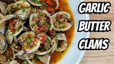 an image of garlic butter clams in a bowl