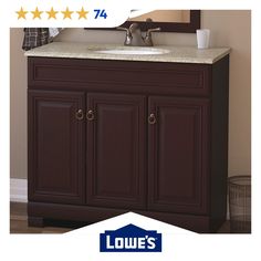 a bathroom vanity with brown cabinets and marble top