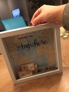 there is a map in the frame with money inside