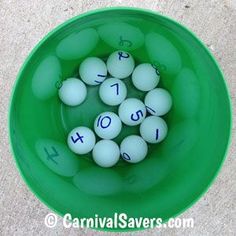 a green bowl filled with lots of white eggs