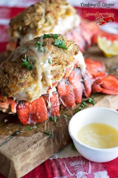 two crab cakes on a cutting board with lemon sauce