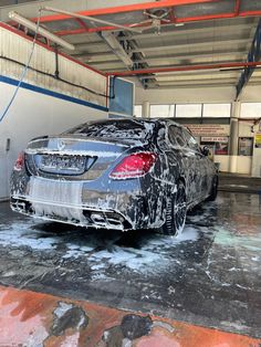 a car is covered in ice and water