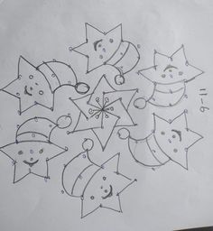 a drawing of stars and faces on paper