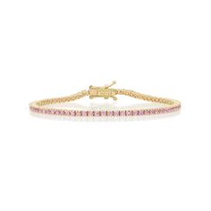 A true classic, our four prong tennis bracelet is handcrafted in 18-karat yellow gold and set with 2.26 carats of round, brilliant-cut pink sapphires. A delicate bracelet with timeless appeal, our tennis bracelet makes the perfect gift for yourself or someone you love. Bracelet measures 6.5 inches in length Carat Weight: 2.26 ct Stone size: 1.8 mm Push Clasp Fastening with Safety Made with love in Los Angeles Complimentary gift wrapping provided Pink Sapphire Tennis Bracelet, Gold Pink Jewellery, Gold And Pink Bracelet, Pink Tennis Bracelet, Pink And Gold Bracelet, Pink Sapphire Bracelet, Pink And Gold Jewelry, Pink Jewerly, Sapphire Tennis Bracelet