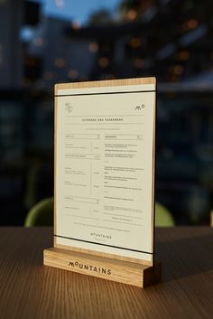 a wooden sign sitting on top of a table