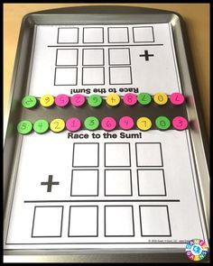 a metal tray with numbers on it and some stickers attached to the top one