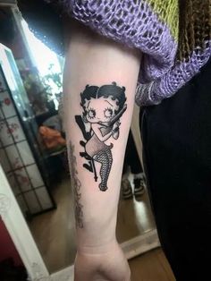 Betty Boop Tattoo Ideas, Betty Boop Tattoo, Betty Boop Tattoos, Iconic Cartoon, Most Popular Cartoons, Nurse Tattoo, Bat Costume, Bat Tattoo, Hip Tattoos Women