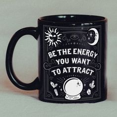 a black coffee mug with the words be the energy you want to attract