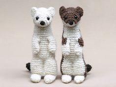 two crocheted stuffed animals sitting next to each other