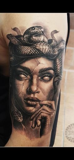 a woman with a snake on her head is shown in this tattoo art photo shoot