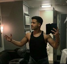 a man is taking a selfie in the mirror