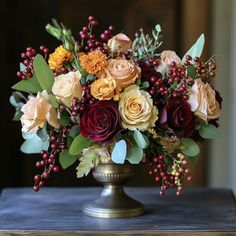 a vase filled with flowers sitting on top of a table