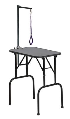 a table with a purple leash attached to it's top and two black legs