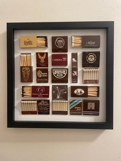 a shadow box with matches in it on the wall