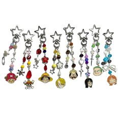 a bunch of charms that are on a white surface