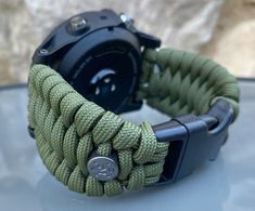 "FREE USPS PRIORITY MAIL SHIPPING FOR DOMESTIC US ORDERS (Includes U.S. Military APO/FPO Address Overseas) Thank you for visiting our shop \"Cording 2U\". A veteran owned business. Handcrafted Paracord wearables customized \"According To You\". Handcrafted with 100% Nylon Paracord \"MADE IN USA\" Our Products include: 🔹Custom handcrafted watch bands according to your wrist size, style, and color of choice. If you don't see it in our page yet, please contact us and we can discuss your options. ? Adjustable Watch Accessories With Analog Display For Outdoor, Functional Green Watch Accessories For Outdoor, Functional Green Outdoor Watch Accessories, Durable Green Watch Bands For Outdoor, Paracord Watchband, Garmin Marq, Paracord Watch, Garmin Fenix, Veteran Owned Business