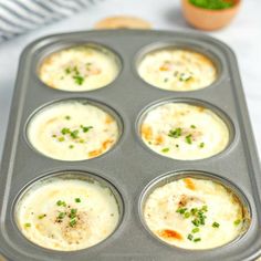 a muffin tin with some food in it