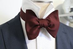 Handsome&Lace Self-Tie Bow Ties: I started creating these oversized butterfly bowties for the real style enthusiasts at the beginning of summer and I'm glad I did! . Tom Ford Sells their satin version for $260 so I decided to make a more affordable version while keeping the highest quality possible. This one in particular, I hand stitched from a Deep Garnet Satin microfiber which has amazing weight, hold, structure and quality. It's seriously THE BEST. Neck band fabric is about 1" wide and t Classic Bow With Ribbon, Formal Summer Bow Tie With Ribbon, Summer Formal Bow Tie With Ribbon, Summer Formal Ribbon Bow Tie, Dapper Bow With Butterfly Knot, Dapper Bow Ties For Semi-formal Occasions, Dapper Bow Tie For Semi-formal Occasions, Dapper Semi-formal Bow With Ties, Dapper Semi-formal Tie With Bow Tie Back