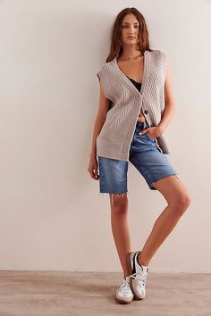 Cozy and cool from our We The Free collection, this slouchy vest features a ribbed merino wool fabrication and deep V-neckline with button-front closures and low-cut armholes. **Fit:** Slouchy, relaxed fit **Features:** Soft merino wool fabrication, ribbed knit design, deep V-neckline, button-front closures, sleeveless-style with low-cut armholes **Why We ❤ It:** This wool vest is perfect for pulling on over your favorite long-sleeve layer. | We The Free Corey Vest Jacket at Free People in White Long Sleeve Layer, Wool Vest, Vest Fashion, Knitting Designs, Boho Outfits, Low Cut, Vest Jacket, Merino Wool, Ribbed Knit