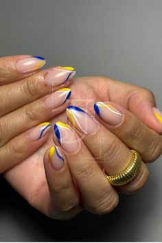 Yellow-blue nail design in Russian technique Yellow Snd Blue Nails, Blue White Yellow Nails, Blue And Yellow Fall Nails, Red Blue And Yellow Nails, Blue Yellow And White Nails, Yellow And Navy Blue Nails, Blue Yellow White Nails, Navy And Yellow Nails