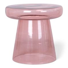 a pink glass table with an oval top and bottom section on the side, in front of a white background