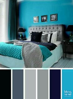 a bedroom with blue and gray walls, white bedding, black pillows and pictures on the wall