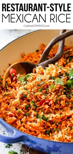 mexican rice in a blue pan with a wooden spoon