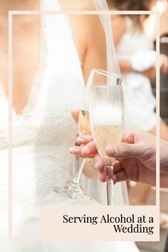 two people holding champagne glasses in their hands with the words serving alcohol at a wedding