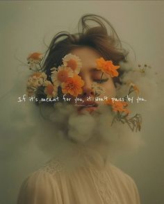 a woman with flowers in her hair and the words if it's meant for you, it doesn't react to you