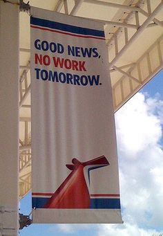 a sign hanging from the side of a building that says good news, no work tomorrow