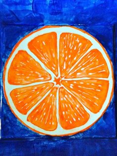 an orange cut in half on a blue background