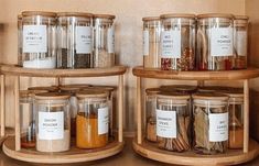 three wooden shelves filled with jars and spices