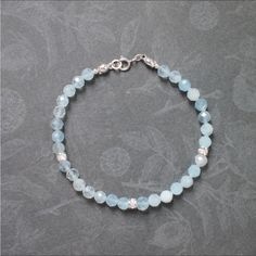 This Lovely Bracelet Is Made Of Beautiful Faceted Aquamarine Stones Of Different Shades Of Aqua Blue. It Could Stack Elegantly With Other Bracelets Or Bangles. Aquamarine Stones Measure Approx. 4.Mm Each! 3mm Additional Sparkle On Bracelet Are All Sterling Silver! Round Or Faucets Beads All Additions Are High Quality Sterling Silver! I Used Lobster Claw Clasp In This One, And All The Findings Used Are 925 Sterling Silver. Bracelet Shown In The Pictures Measures 8”1/4 - Or A 8”1/2 On Others Made! Adjustable Aquamarine Silver Bracelet, Adjustable Silver Aquamarine Bracelets, Adjustable Silver Aquamarine Bracelet, Elegant Handmade Light Blue Crystal Bracelet, Handmade Silver Crystal Bracelet For Everyday, Shades Of Aqua, Aquamarine Bracelet, Product Video, Aquamarine Stone