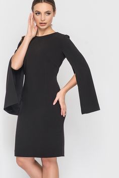 We love this dress! It is simple but still stunning in the details. No matter what occasion you wear this dress, you will receive many compliments. The dress has long sleeves that open from the top of the schest. This creates a cape effect. The hem plays around the knee, depending on body size. The fabric is a soft viscose blend that adapats to your figure and is comfortable to wear in any season. The dress is figure-playing. The dress ANGEL is lined inside the sleeves. You can wash it in your w Wing Sleeve Dress, Black Dress Business, Cape Sleeve Dress, Wedding Guest Dress Midi, Elegant Wedding Guest Dress, Going Out Dress, Dress Business, Professional Dress, Black Cape