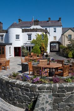 an outdoor dining area with tables and chairs