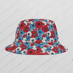 First, it protected fishermen from rain in the 1900s. Now, the personalized bucket hat is making its way to the very top of fashion picks for all ages.  .: Material: 100% polyester .: Available in 2 sizes  .: Two stitching color options to pick from .: Sewn-in label .: Made in USA FREE SHIPPING Blue Bucket Hat, Patriotic Fashion, Sun Hat, Red White Blue, Sew-in Labels, Sun Hats, White Blue, Bucket Hat, Color Options