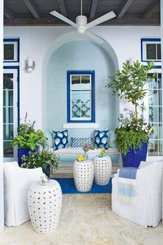 a living room with blue and white furniture