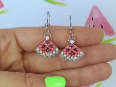 These beautiful beaded Watermelon earrings are small and simple, which makes them perfect for everyday wear, but also suitable for special occasions.  ✤ SIZE (Approx.): ▸ Lenght: 2,5 cm (0.98 inches). ✤ MATERIAL: ▸ Pastel red, pastel green, pearl white and dark silver beads (size 11/0). ▸ Strong and durable beading thread. ▸ High quality stainless steel ear wire. Please note that colors may appear slightly different due to variations in monitors and browsers. ✤ SHIPPING: ▸ I will ship as soon as possible, approximately in 1-2 business days after receipt of payment.  ▸ Each order is carefully packed. Orders are shipped with Slovenian post (standard shipping) and tracking number. ▸ I will try my best to send out orders as soon as possible, but I can not guarantee or control the shipping time Hypoallergenic Beaded Earrings With Round Beads For Summer, Summer Teardrop Earrings With Tiny Beads, Teardrop Earrings With Tiny Beads For Summer, Summer Hypoallergenic Earrings With Round Beads, Summer Hypoallergenic Beaded Dangle Earrings, Beaded Watermelon, Watermelon Jewelry, Beaded Fruit, Earrings Handmade Beaded