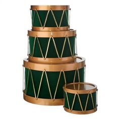 three green drums stacked on top of each other with gold trimmings and metal handles